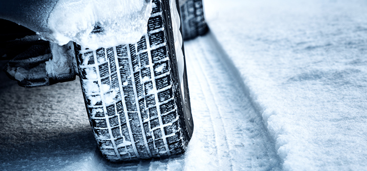 Car on ice and snow-ridden road 