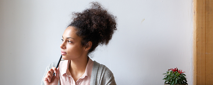 Woman thinking about budgeting 