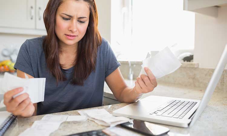 Young woman concerned about bills